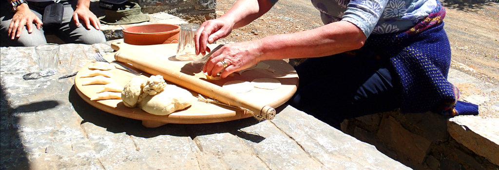 kneading traditional pies and bread on a table made of stone